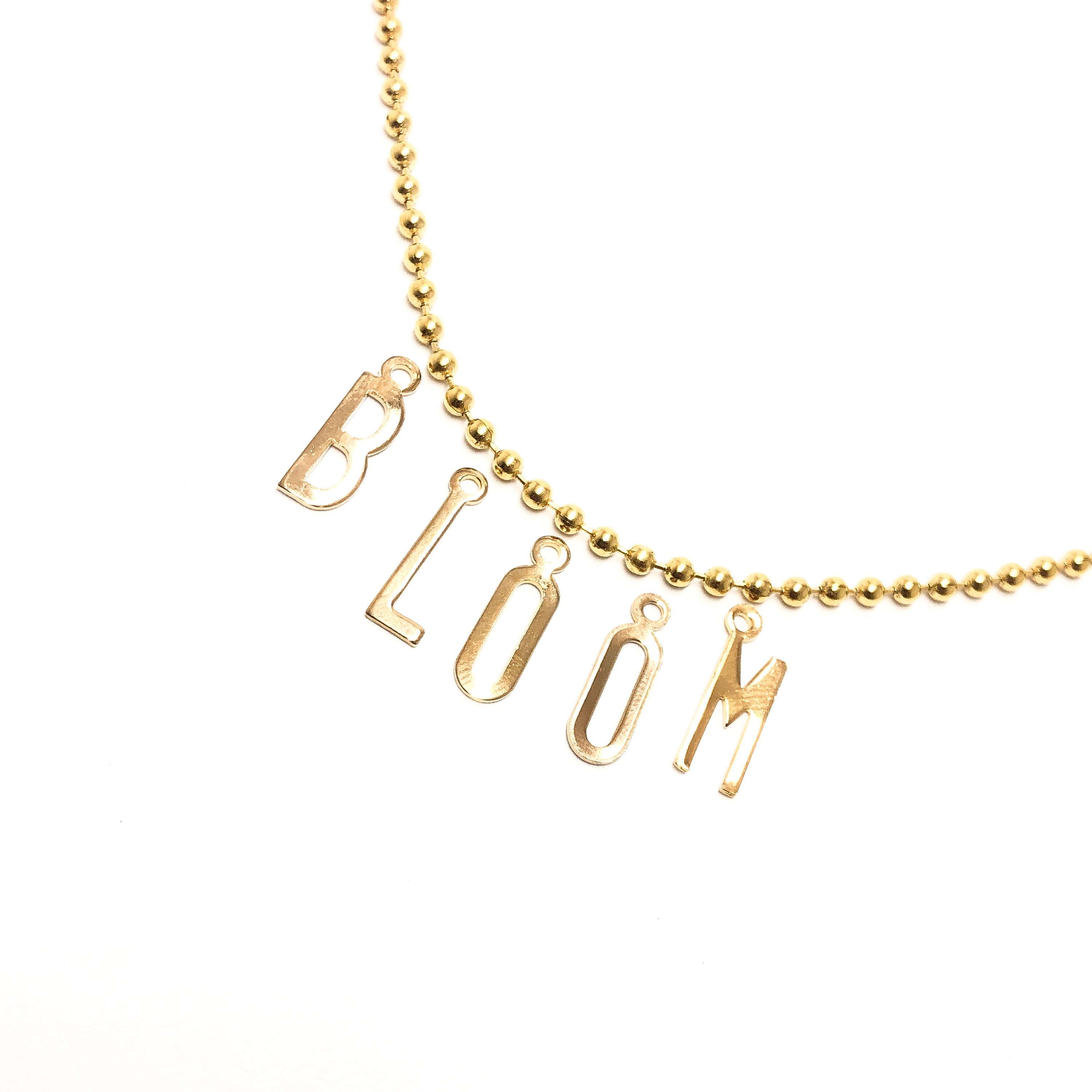 Moon and Lola - Belize Necklace with letters spelling BLOOM