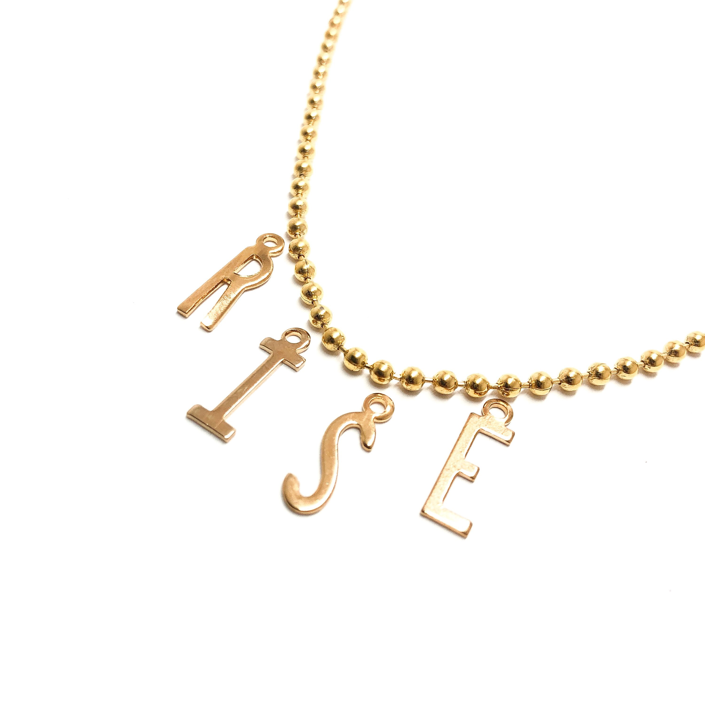Moon and Lola - Belize Necklace with letters spelling RISE