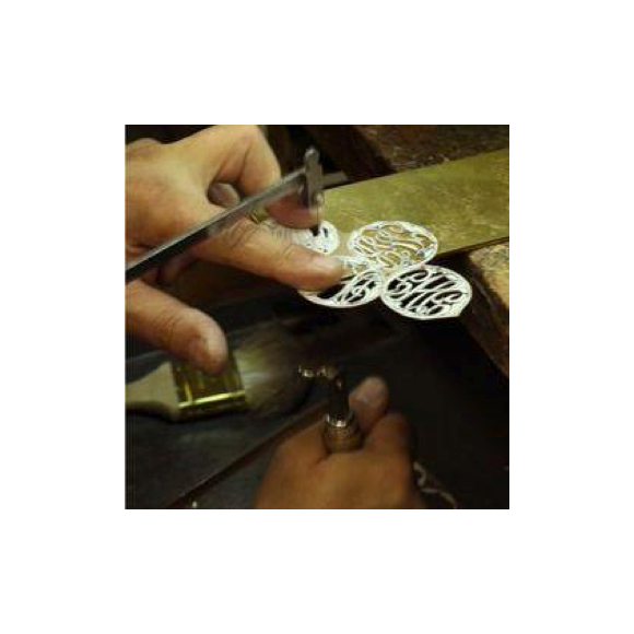 Moon and Lola production of hand-drawn hand-cut fine metals