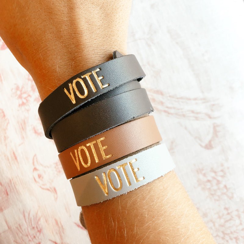 Moon and Lola - Sayre Gold Foil VOTE Bracelets stack of four on model