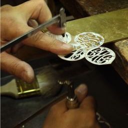 Moon and Lola production of hand-drawn hand-cut fine metals
