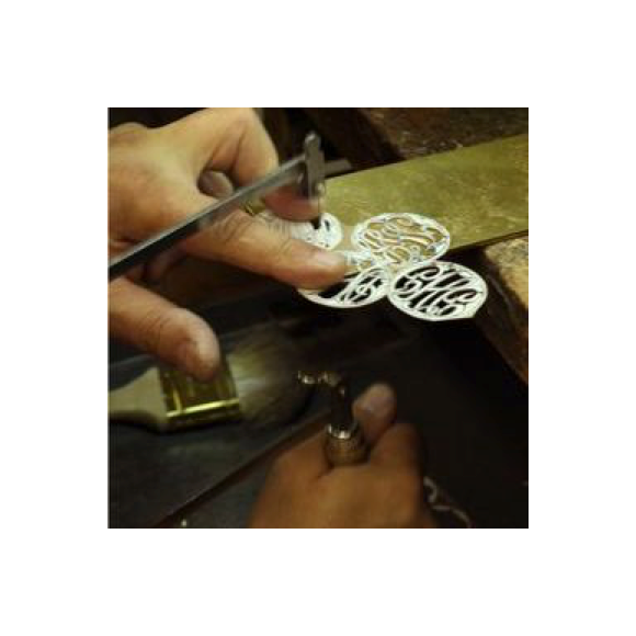 Moon and Lola production of hand-drawn hand-cut fine metals
